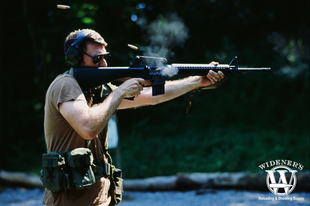 a photo of a man shooting a 3 round burst