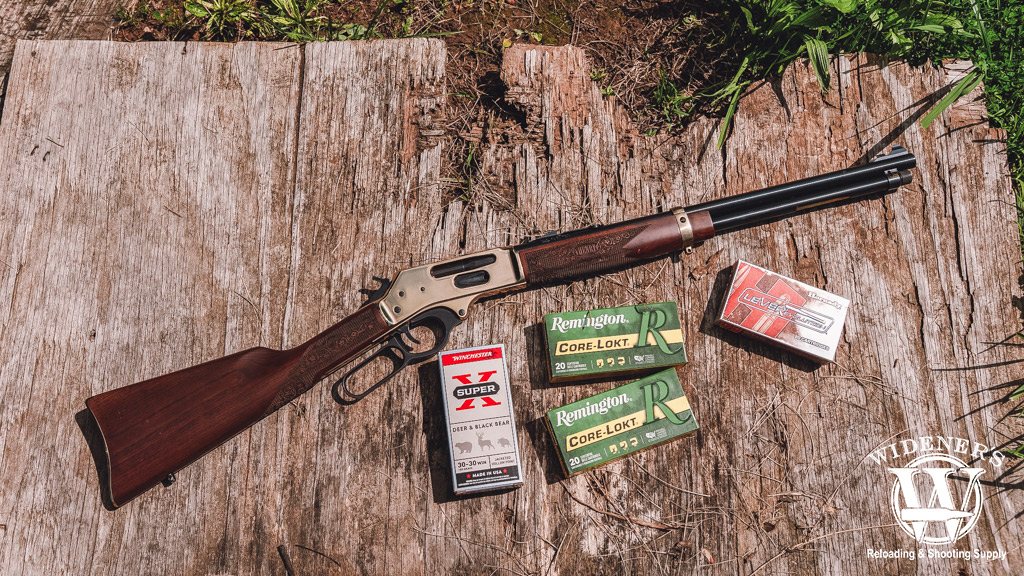 a photo of a henry lever action rifle with ammo