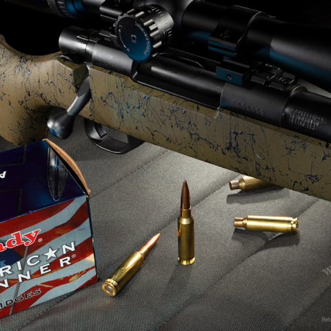 photo of a bolt action rifle and centerfire ammo