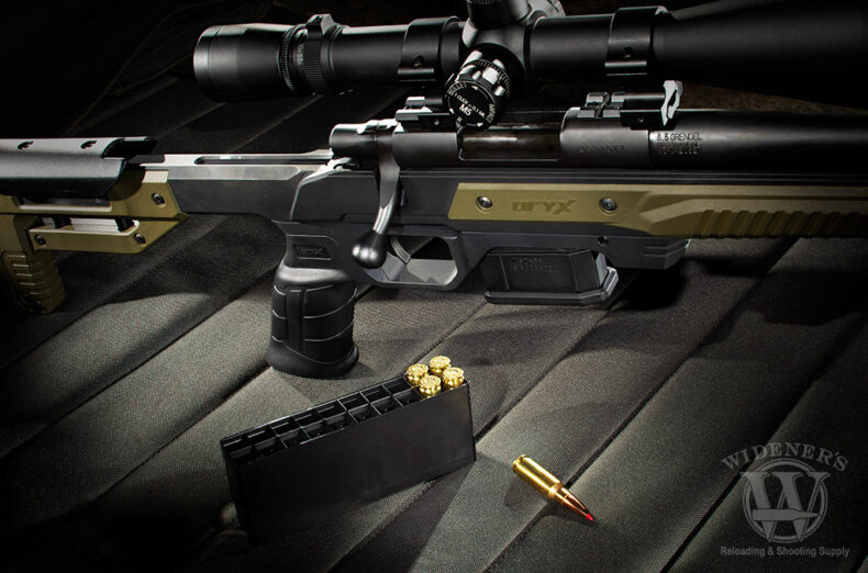 a photo of a bolt action rifle with ammo