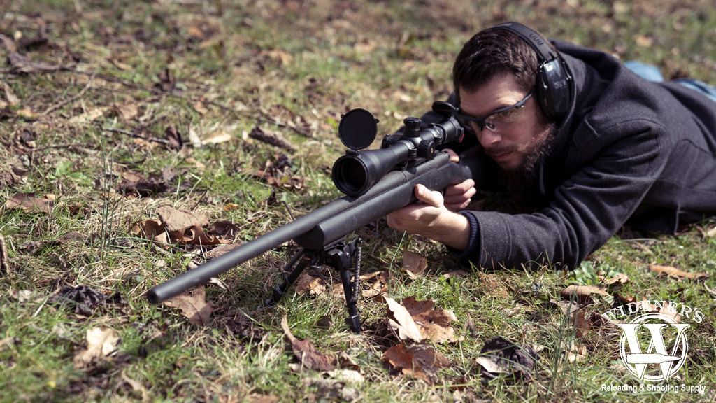 a photo of a man shooting a 300 win mag hunting rifle