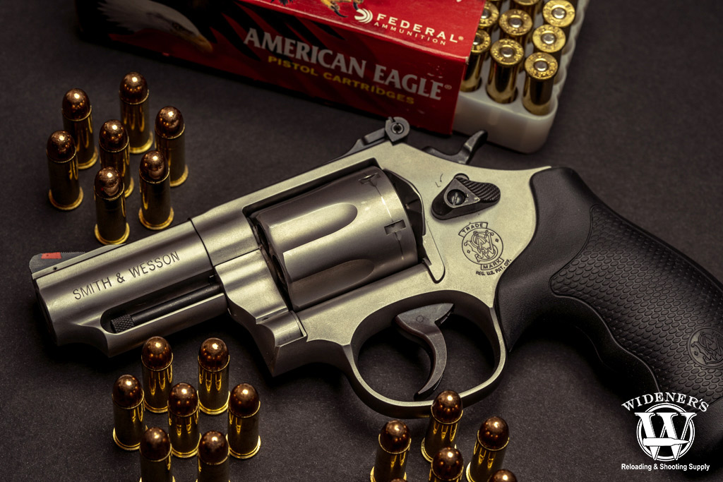a photo of a smith & wesson revolver and ball ammo