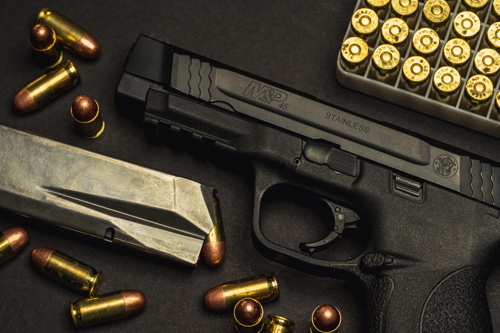 a photo of a smith & wesson M&P 45 acp pistol with ball ammo