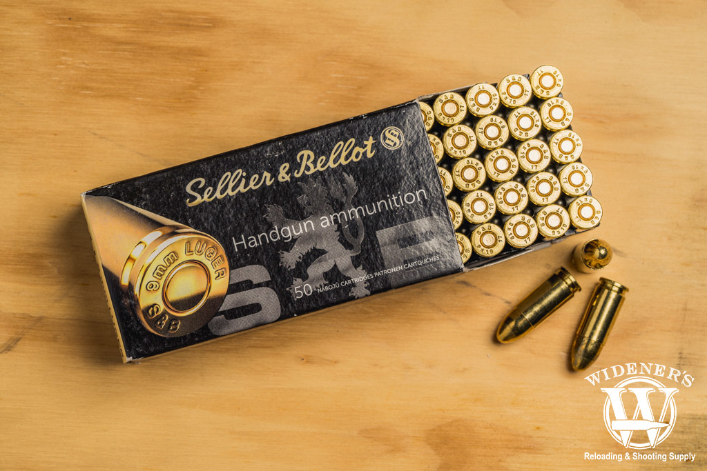 photo of sellier & bellot 9mm 115gr ammo on a sheet of plywood