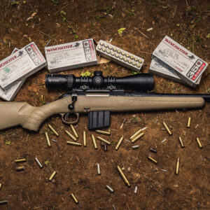 photo of the ruger american ranch rifle next to winchester 350 legend ammo