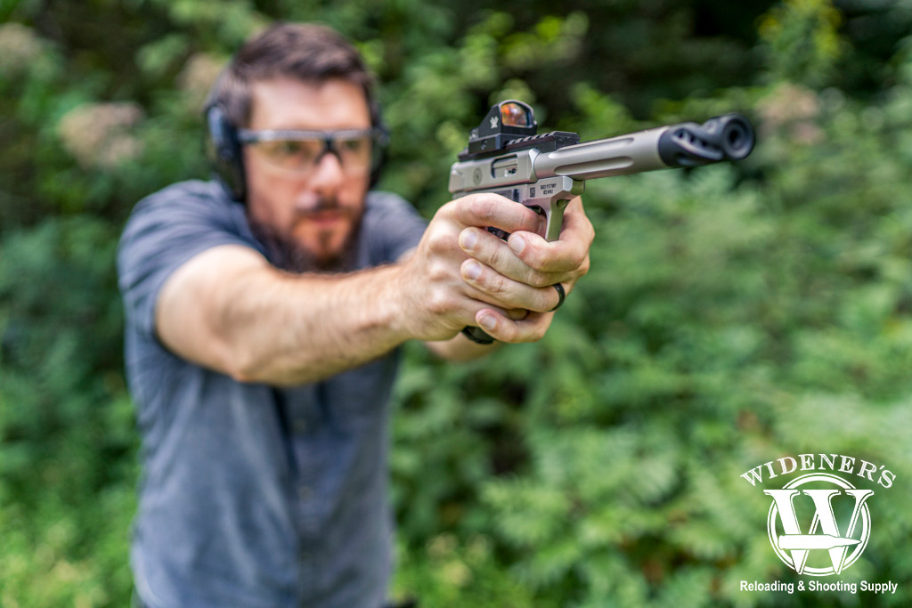 a photo of a man testing the effective range of .22LR with a pistol