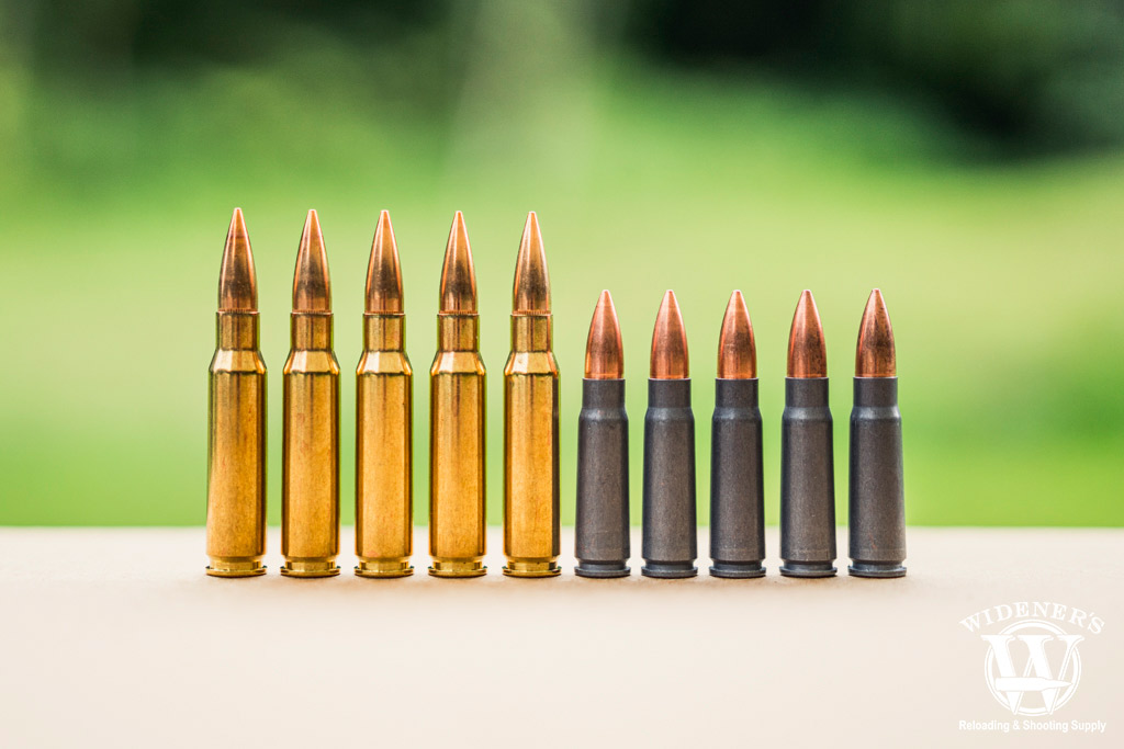 a photo comparing 7.62x39 VS 308 winchester cartridges