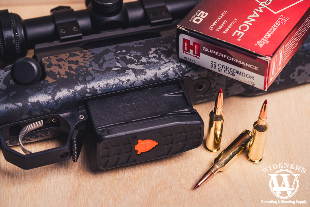 a bolt action rifle and ammo a photo of a bolt action rifle and ammo