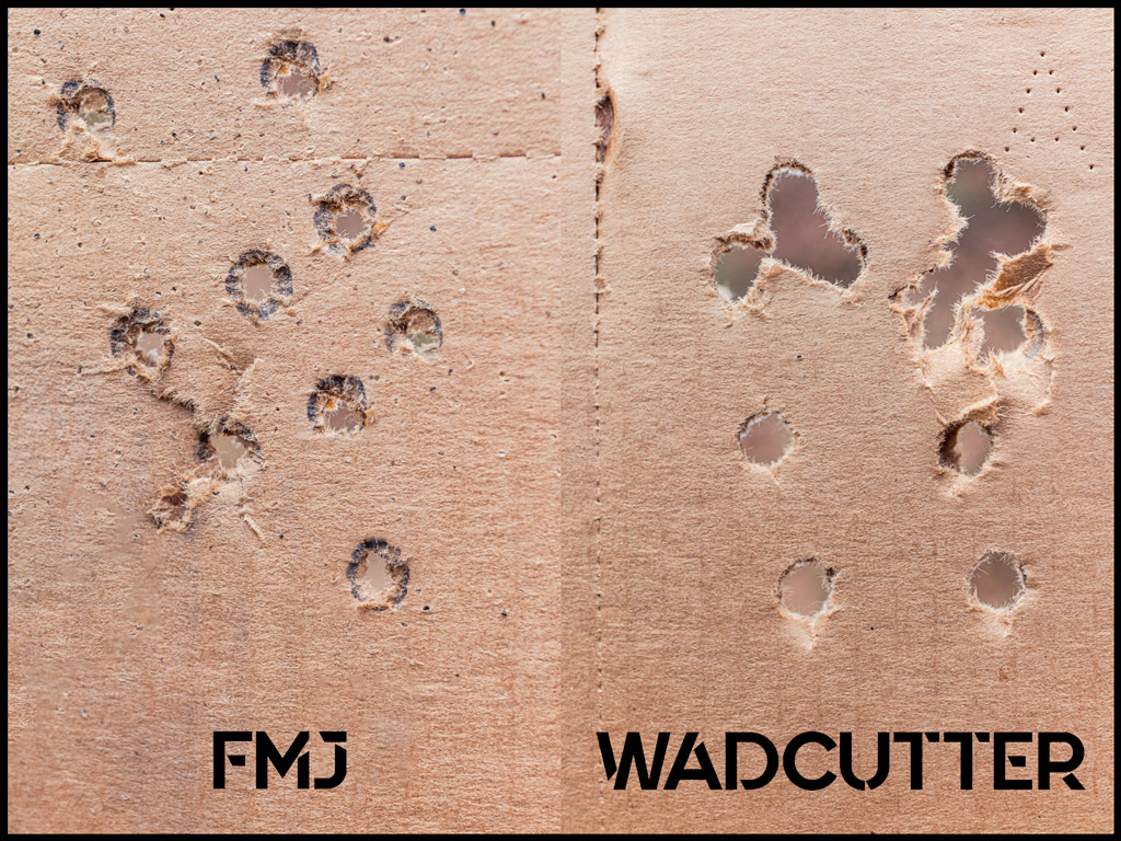 a photo comparing fmj vs wadcutter ammo on a paper target