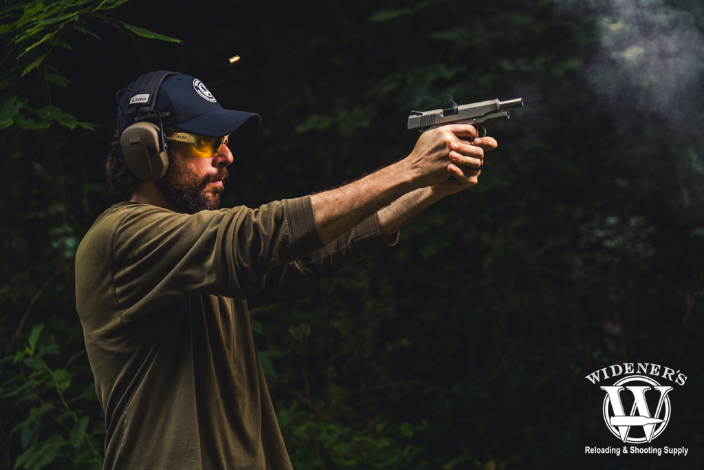 a man shooting a Dan Wesson Commander Classic a photo of a man shooting a Dan Wesson Commander Classic