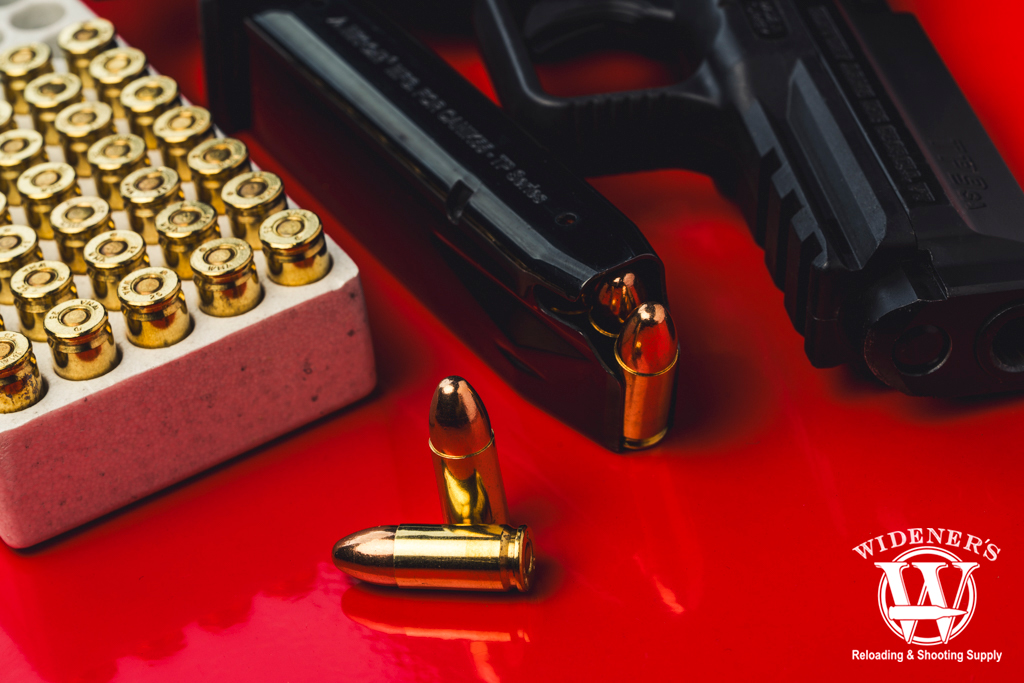 a photo of a handgun with ammunition 