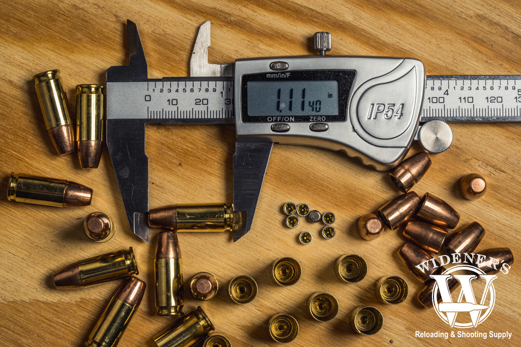 a photo of calipers measuring a reloaded 9mm bullet