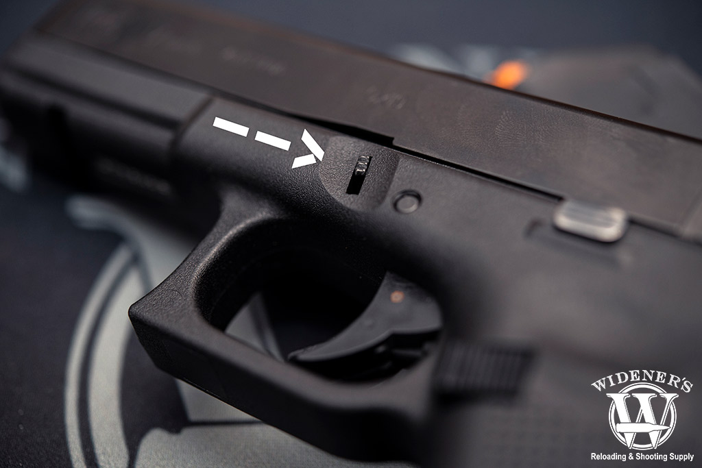 a photo of the glock 17 slide release field strip a glock pistol