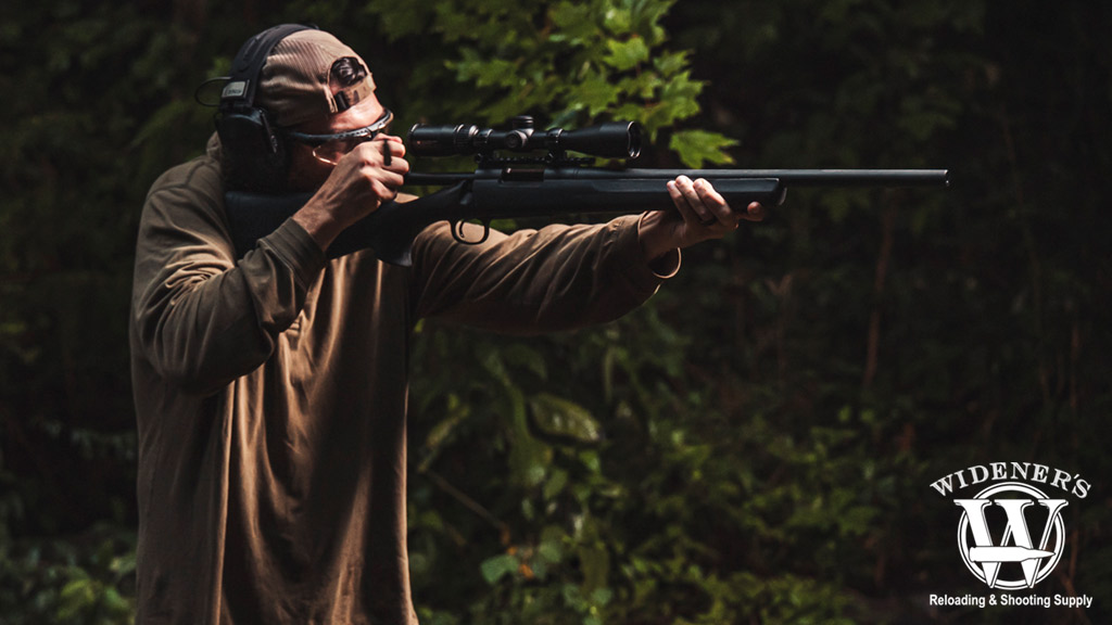 man shooting a bolt action rifle a photo of a man shooting a bolt action rifle
