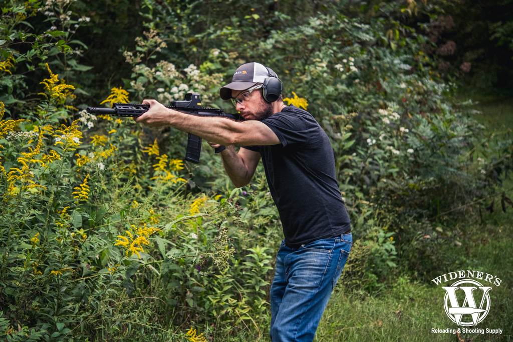 a photo of a man shooting 45-70 VS 450 Bushmaster