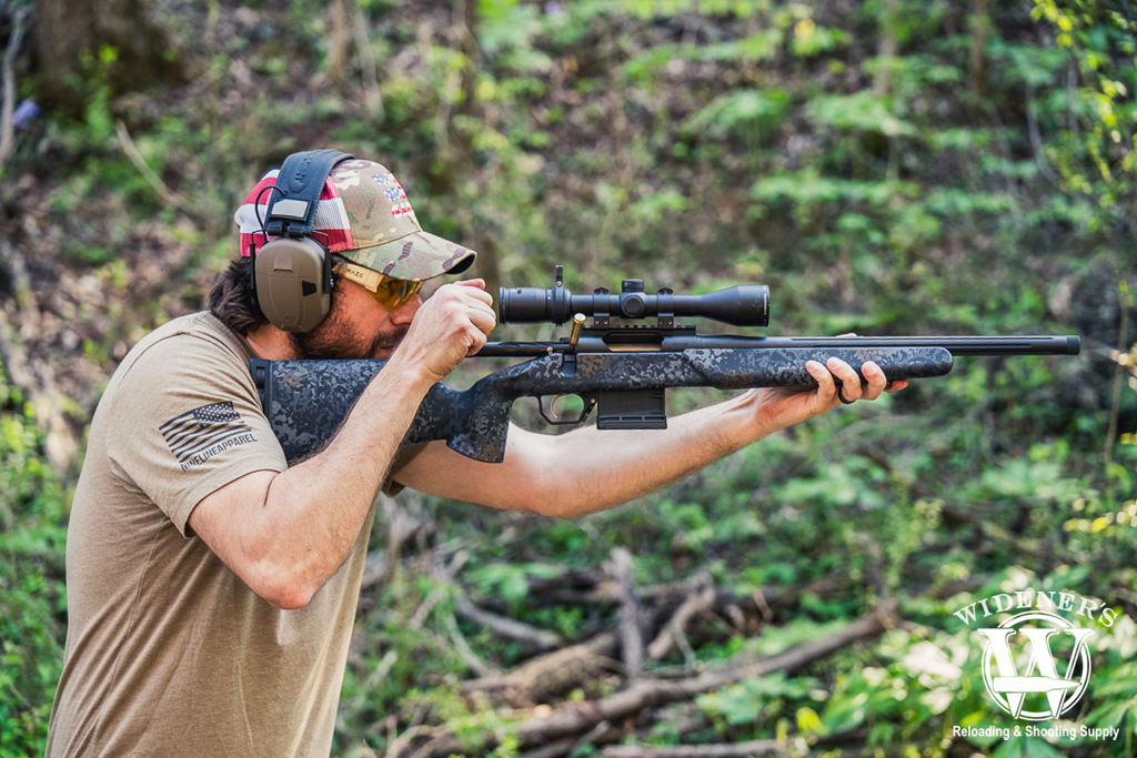 man shooting a bolt action rifle a photo of a man shooting a bolt action rifle