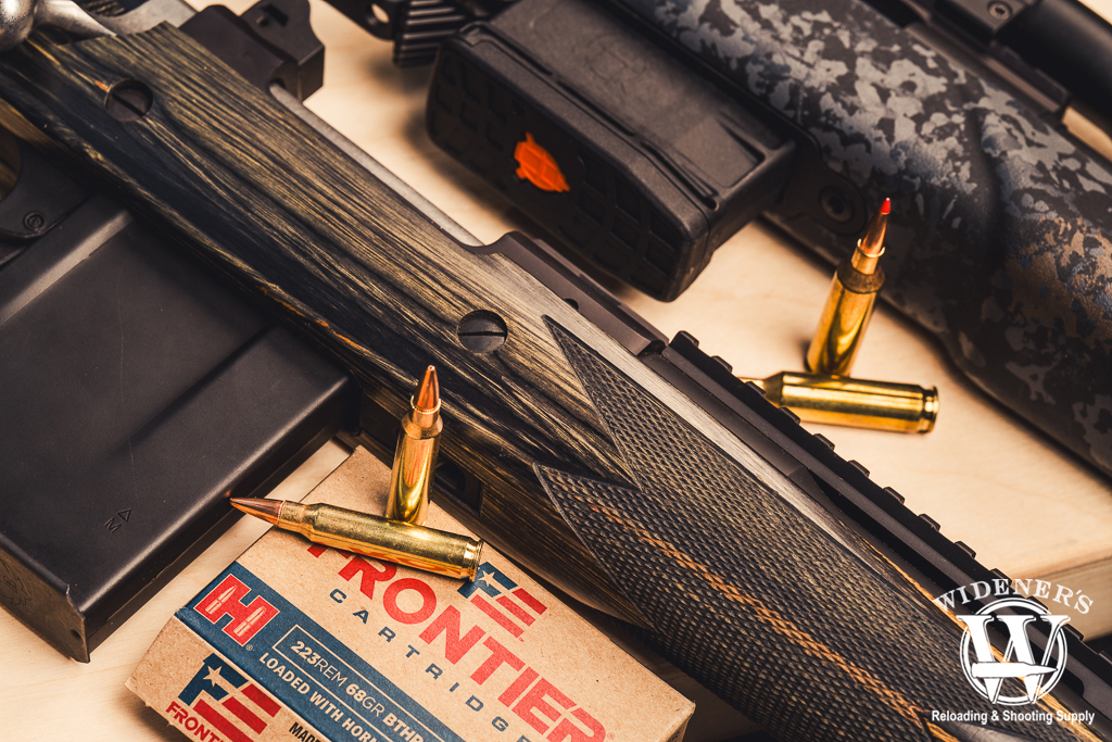 two bolt action rifles with 22 Creedmoor VS 223 Remington ammo a photo of two bolt action rifles with 22 Creedmoor VS 223 Remington ammo