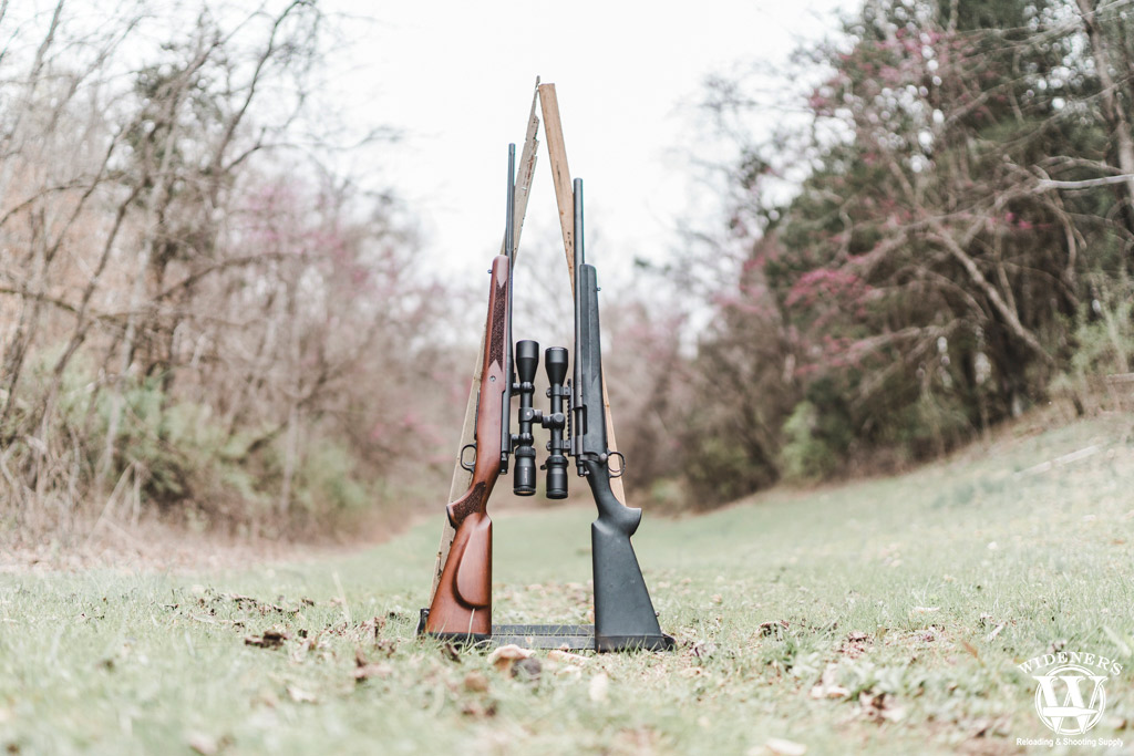 a photo of two bolt action hunting rifles 