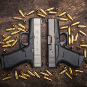A photo of a glock 43 vs 43x with 9mm ammo