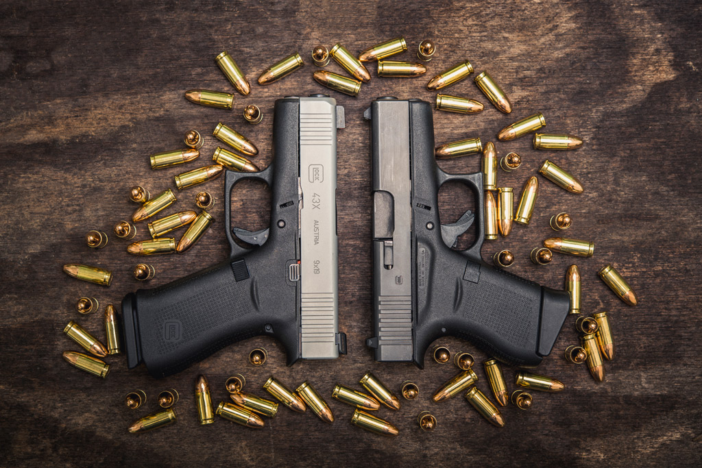 A photo of a glock 43 vs 43x with 9mm ammo