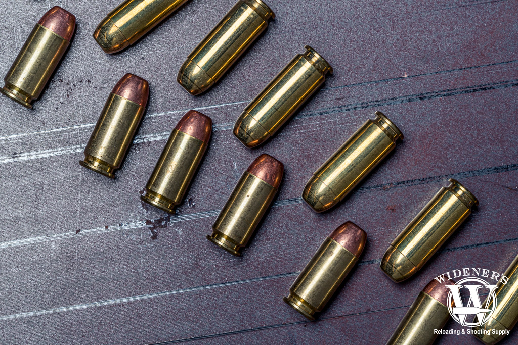 A photo comparing the 10mm cartridge on the top, and the .40 S&W cartridge on the bottom