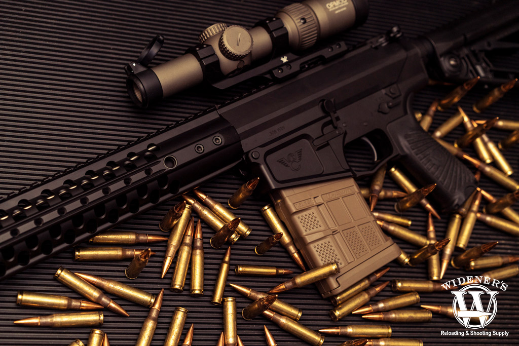 a photo of a ar-10 rifle with 308 caliber ammo