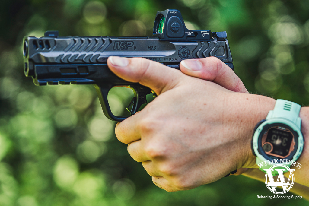 a photo of a female shooting a s&w handgun 