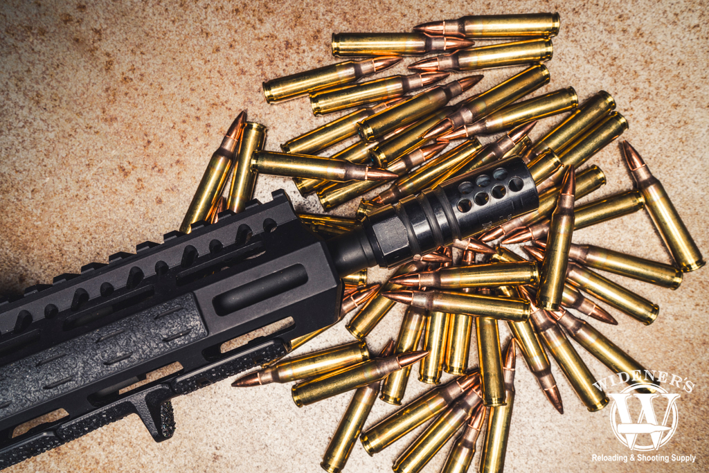 rifle compensator with 223 ammo a photo of a rifle compensator with 223 ammo