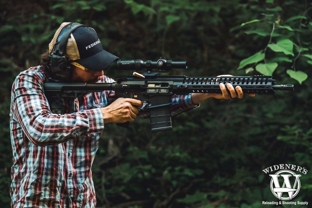 man shooting a semi auto rifle a photo of a man shooting a semi auto rifle