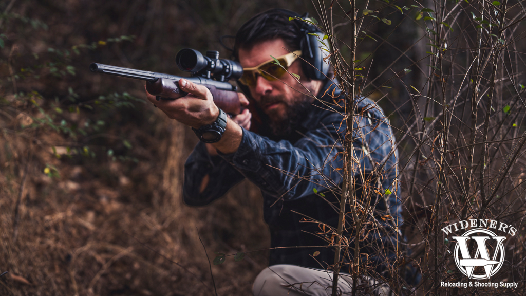 a man shooting a bolt action rifle a photo of a man shooting a bolt action rifle