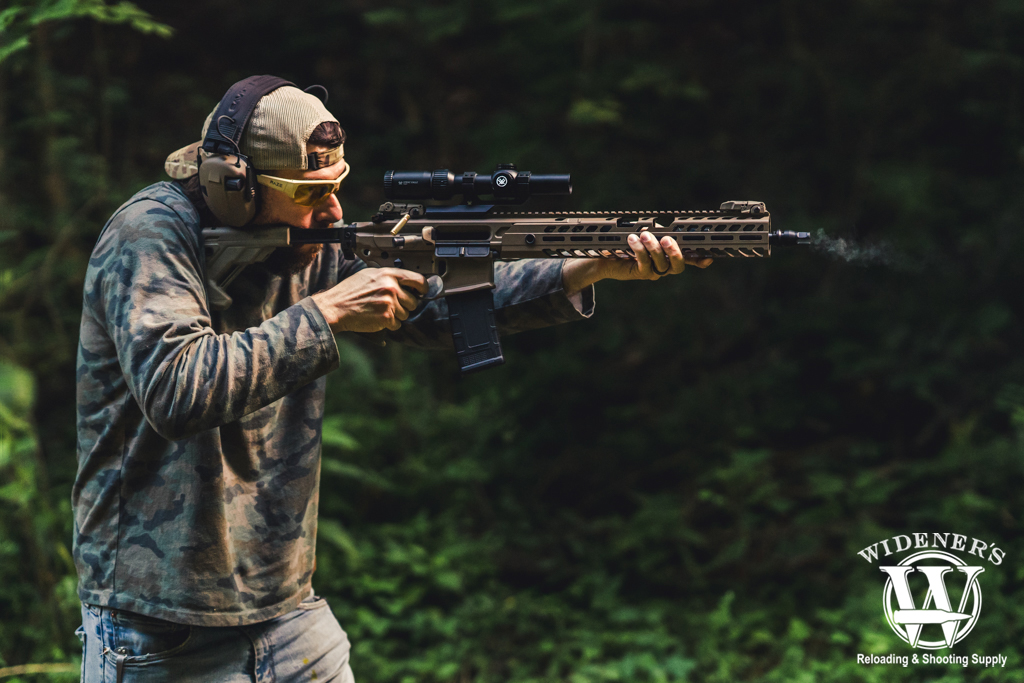 man shooting a modular rifle a photo of a man shooting a modular rifle