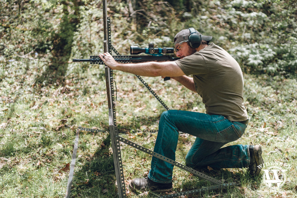 a photo of a man shooting a 308 semi auto rifle
