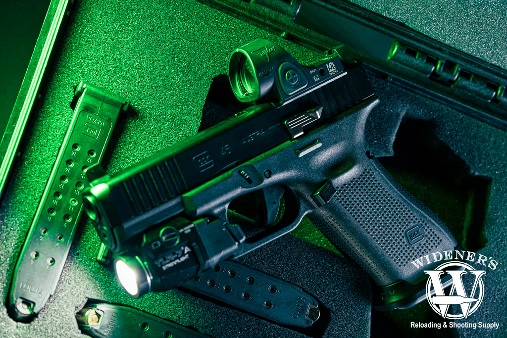 a photo of a handgun with a trijicon SRO optic