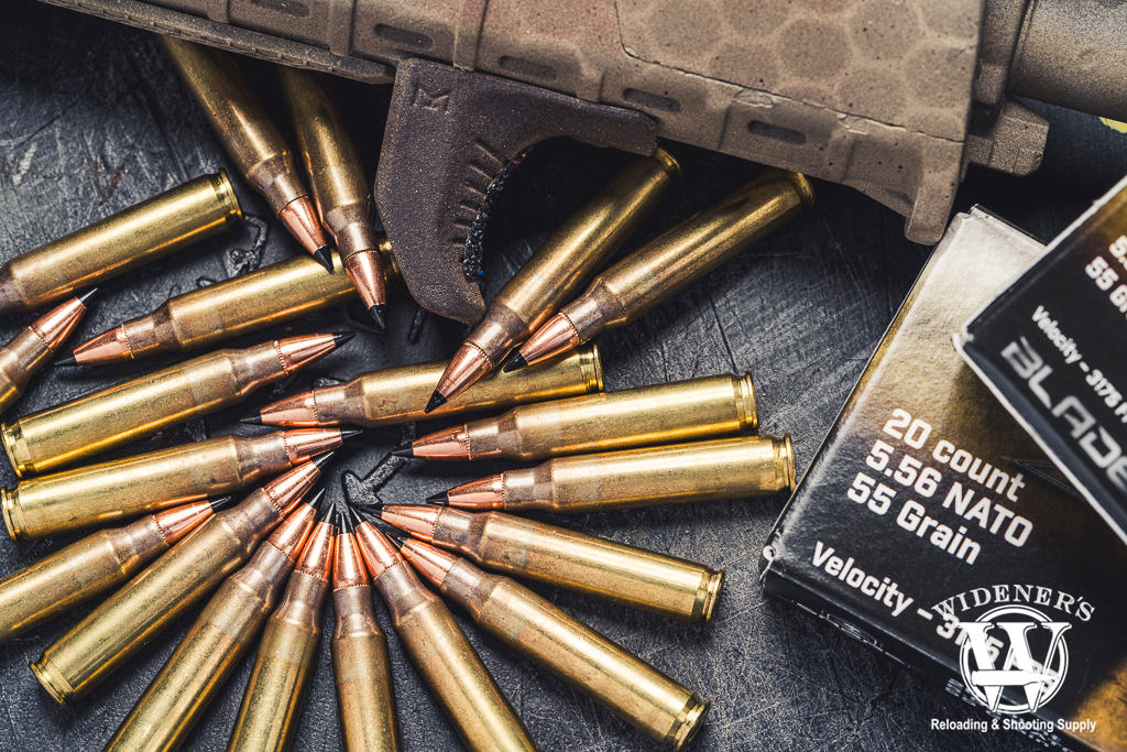 a photo of 223 Rem ammo and an ar-15 rifle