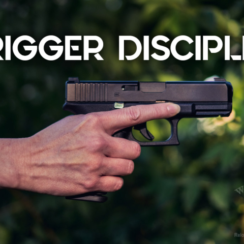 a photo of a female hand demonstrating trigger discipline