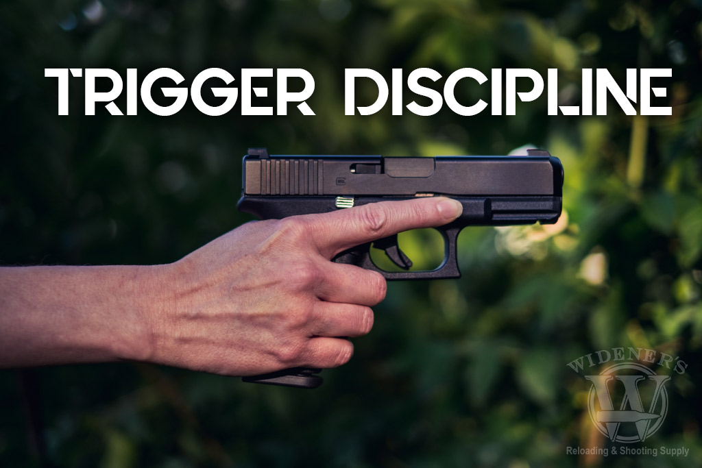 a photo of a female hand demonstrating trigger discipline