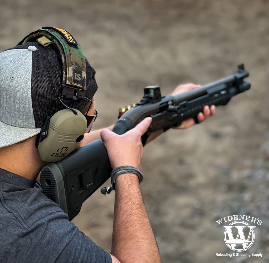 a photo of a man shooting a Beretta 1301 Tactical shotgun