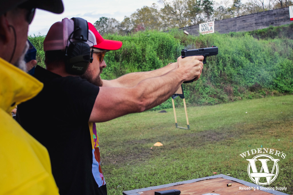 photo of a man shooting a glock pistol at a gssf match