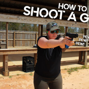 photo of kenzie fitzpatrick demonstrating how to shoot a handgun
