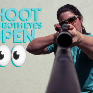 photo of a female shooting a rifle with both eyes open
