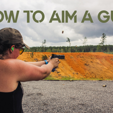 female showing how to aim a gun