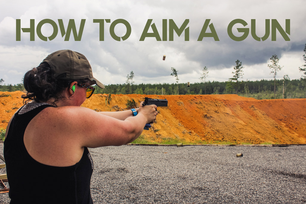 female showing how to aim a gun