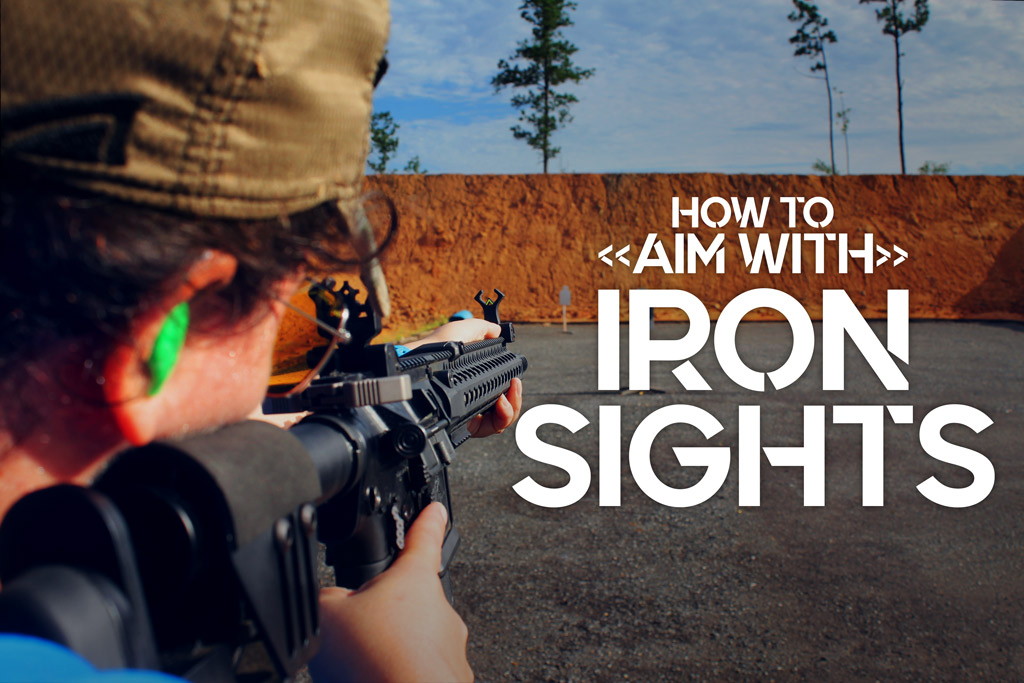 a photo of a female shooter showing how to aim with iron sights