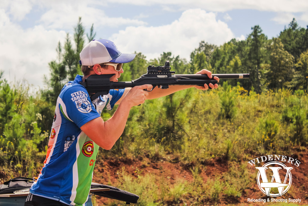 a photo of a male competition shooter at a steel challenge match