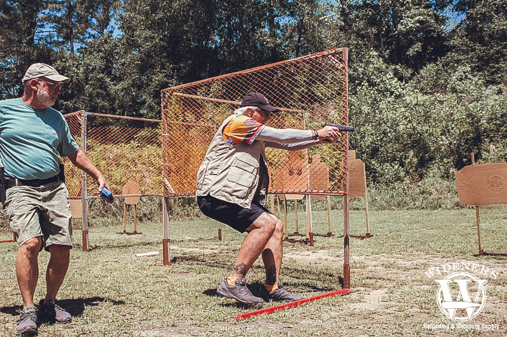 a photo of a competition shooter in action