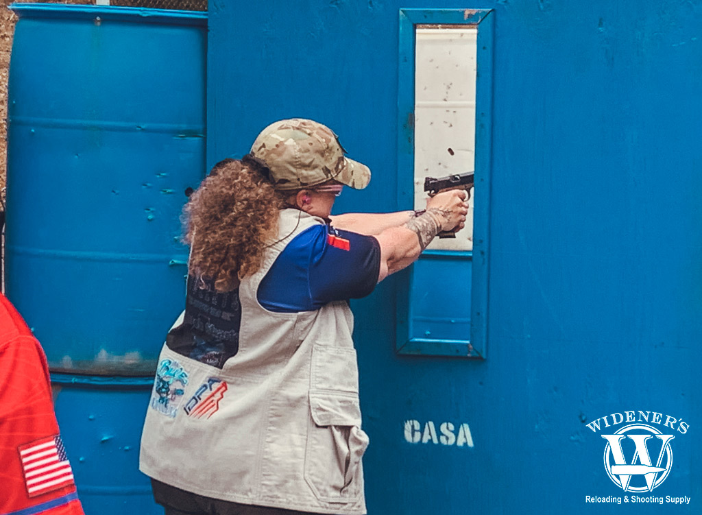 a photo of a female competition shooter