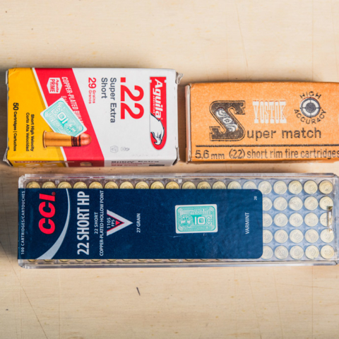 photo of boxes of 22 short ammo on plywood