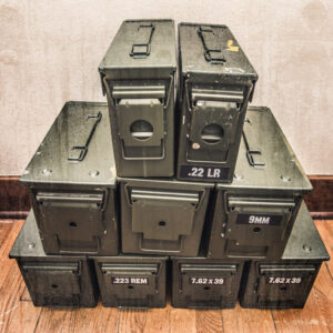 photo of ammo storage boxes stacked on a wooden floor