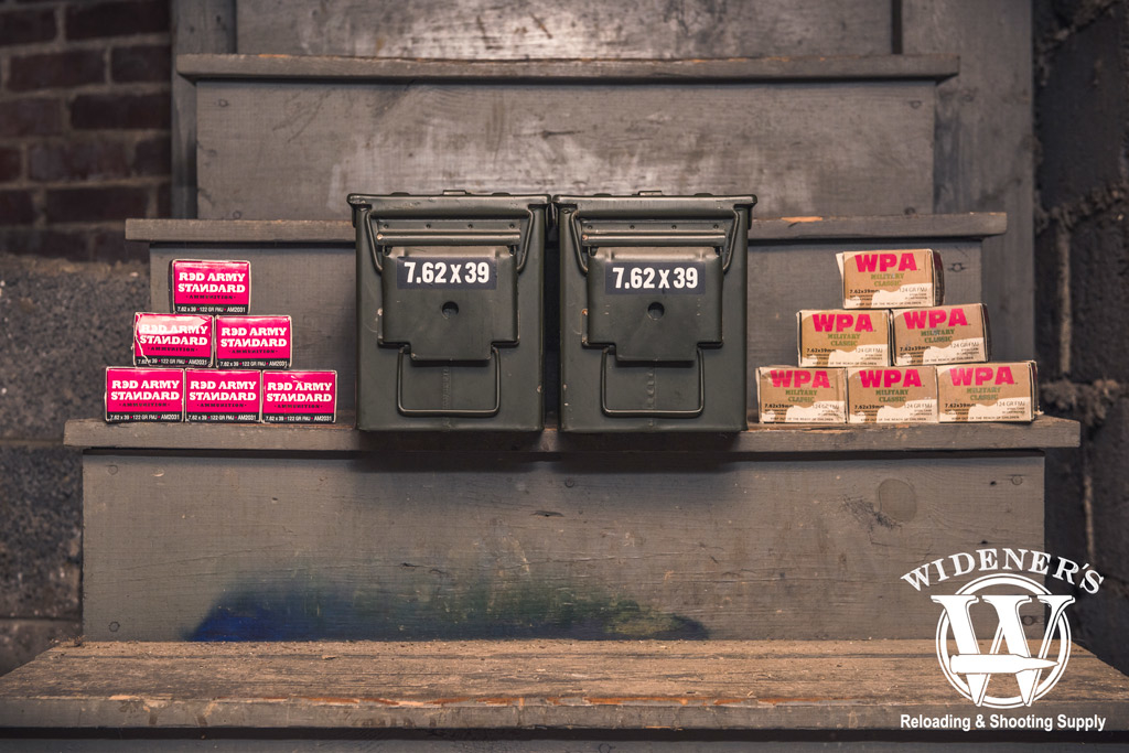 photo of ammo boxes and 50 cal ammo storage boxes stored in a basement