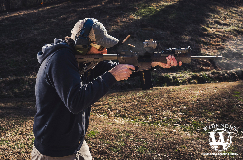 man shooting an ar-15 a photo of a man shooting an ar-15